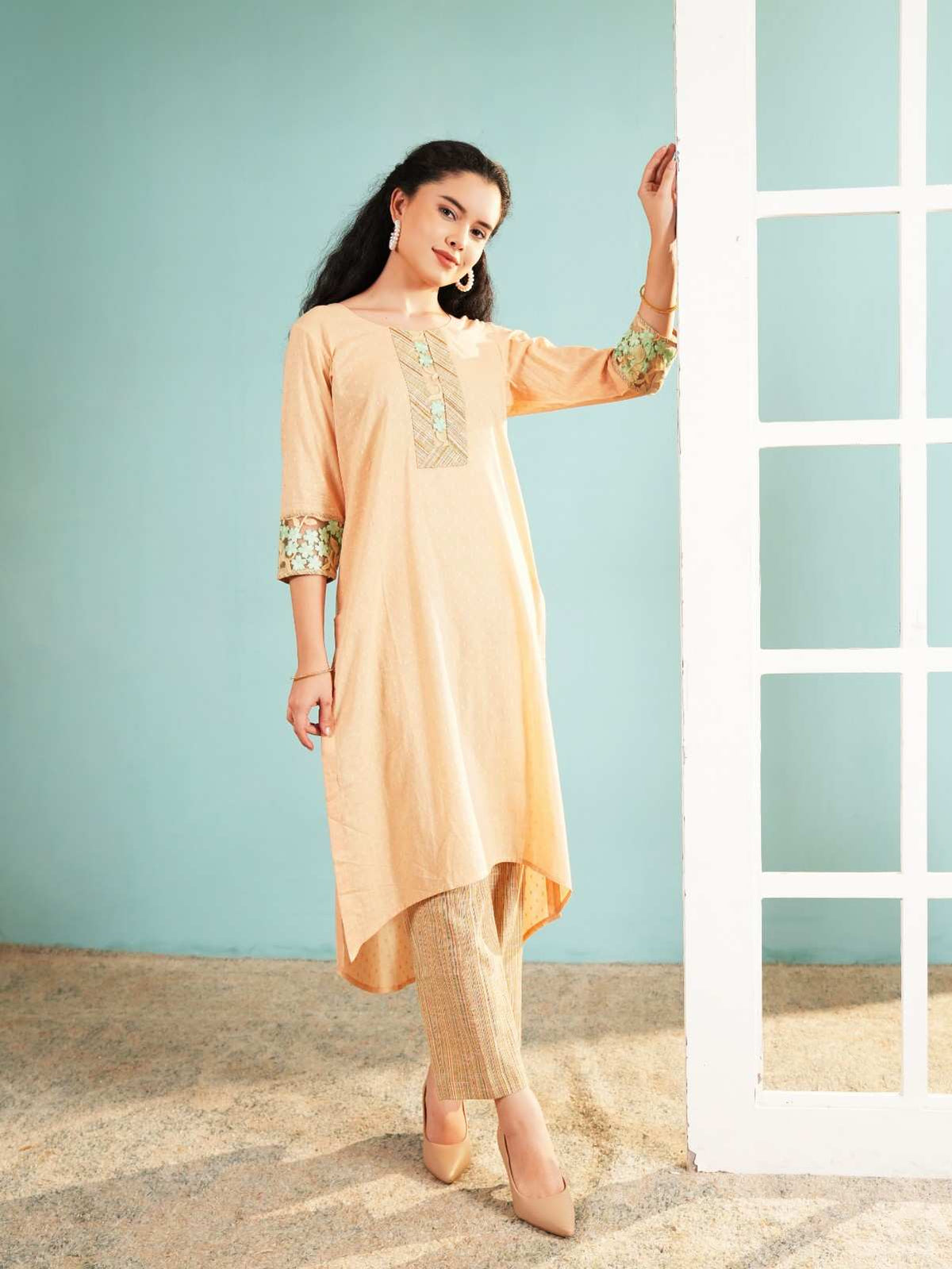 Peach high-low embroidered kurta and pant set, 3/4 sleeves with floral cuffs