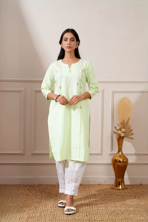 Lime green cotton straight kurta with white afghani pants, front view