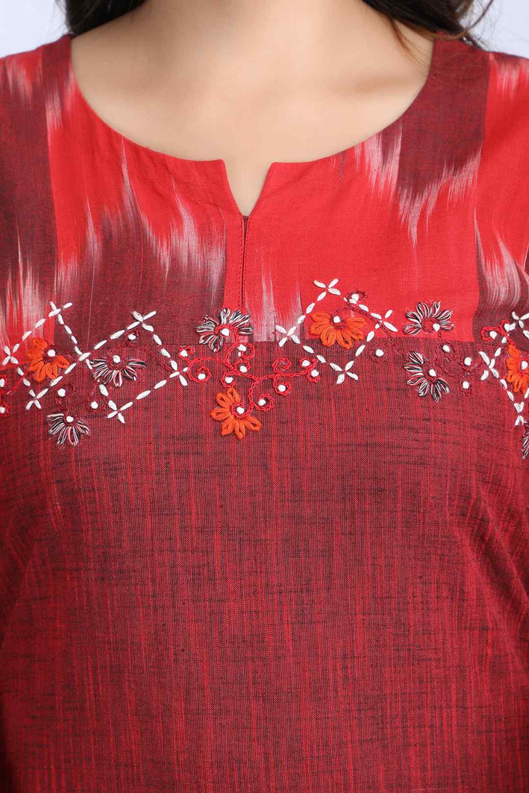 Maroon kurta front with embroidered floral detail and V-shaped yoke