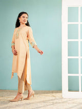Peach high-low embroidered kurta with side slit over matching striped pants