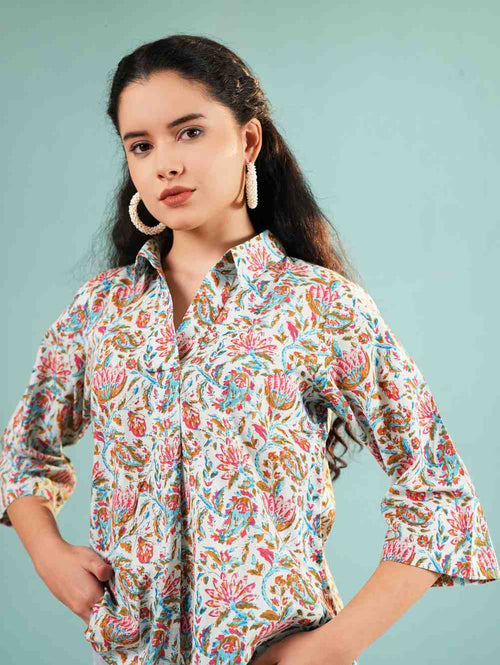 Floral collared tunic with colorful print, button front, 3/4 sleeves, curved hem